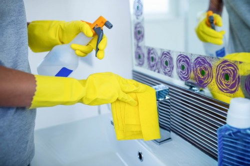 Technician performing mattress cleaning in Elmers End with sanitising treatment